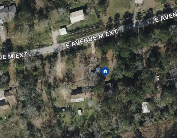 an aerial view of residential house with outdoor space
