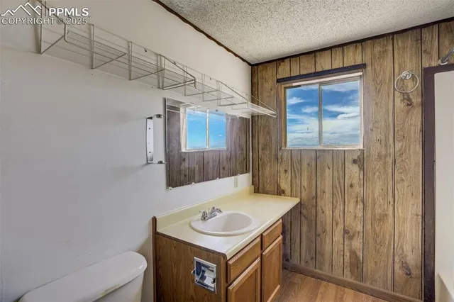 a bathroom with a shower and a sink