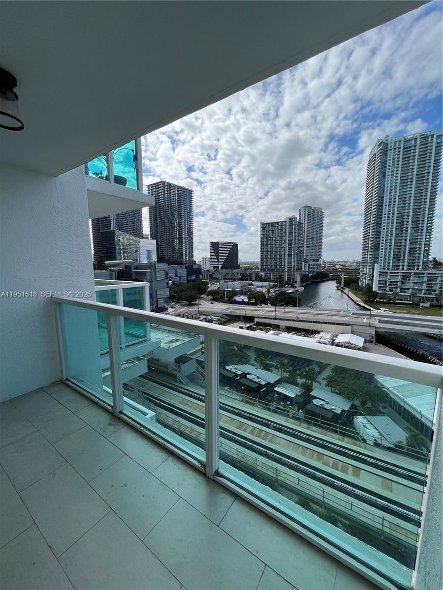 a kitchen with kitchen island granite countertop a sink and a stove