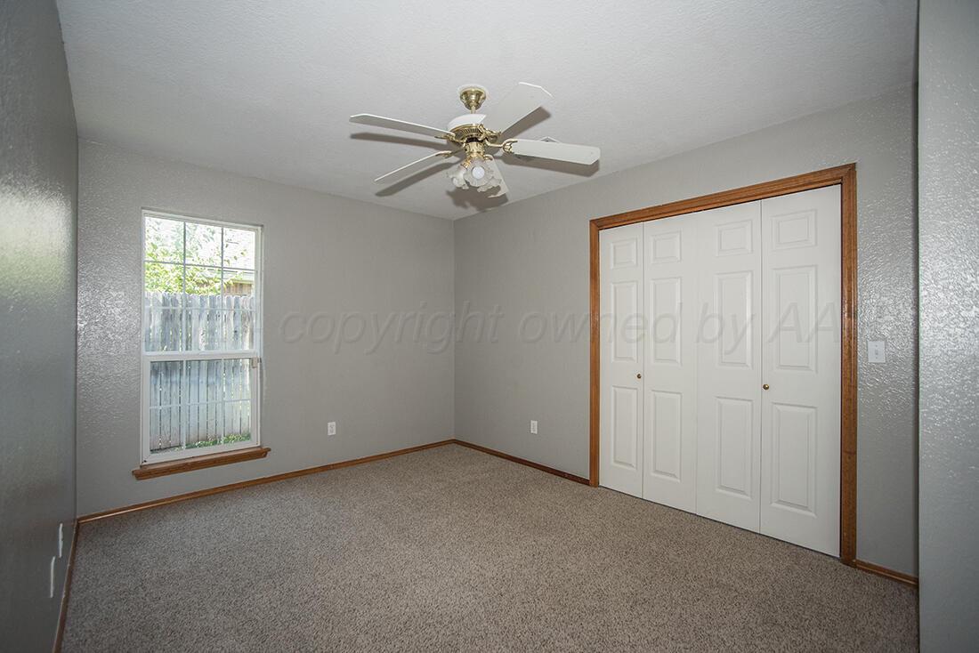 7909 Triumph Place Amarillo, TX 79119 - Photo 12 of 21 a view of an empty room with a window