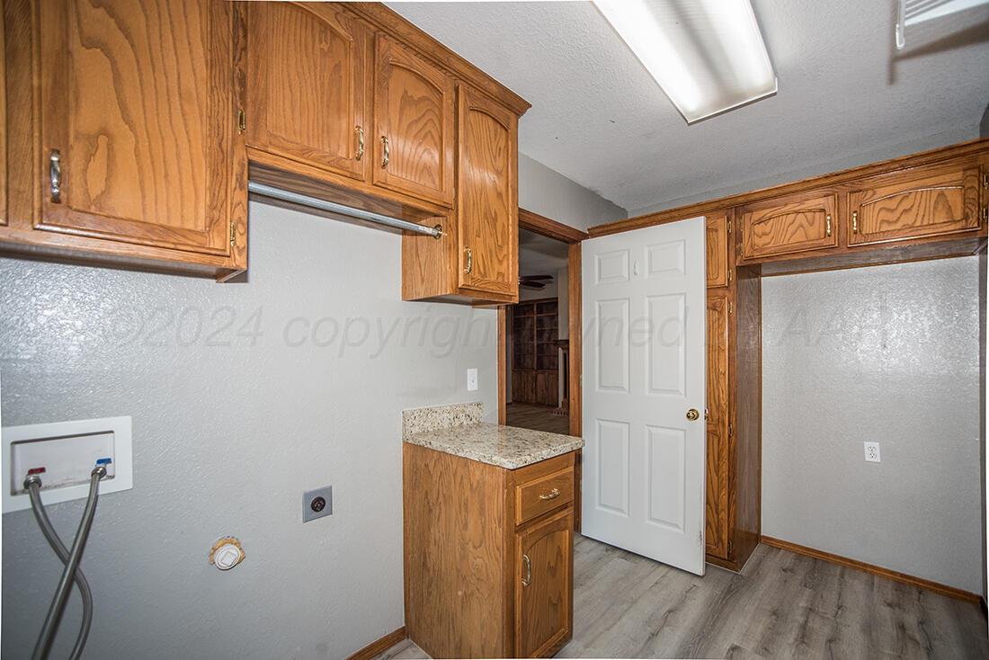 7909 Triumph Place Amarillo, TX 79119 - Photo 15 of 21 a view of storage and utility room with wooden floor