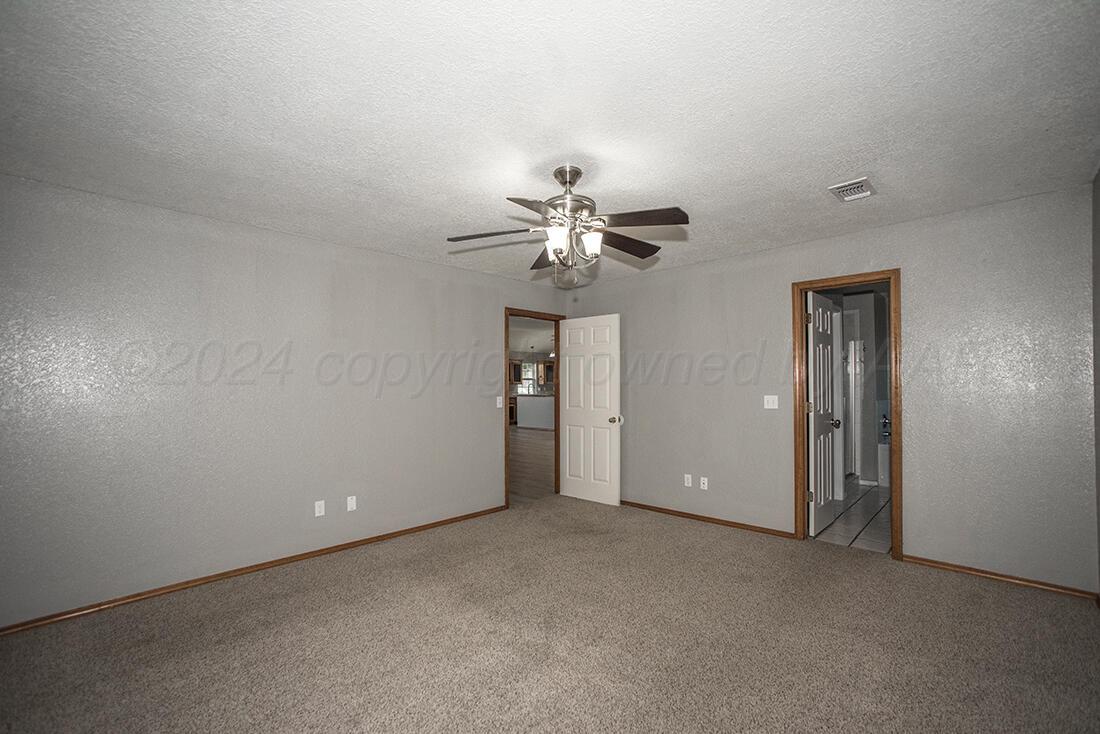 7909 Triumph Place Amarillo, TX 79119 - Photo 17 of 21 a view of a chandelier fan and entryway
