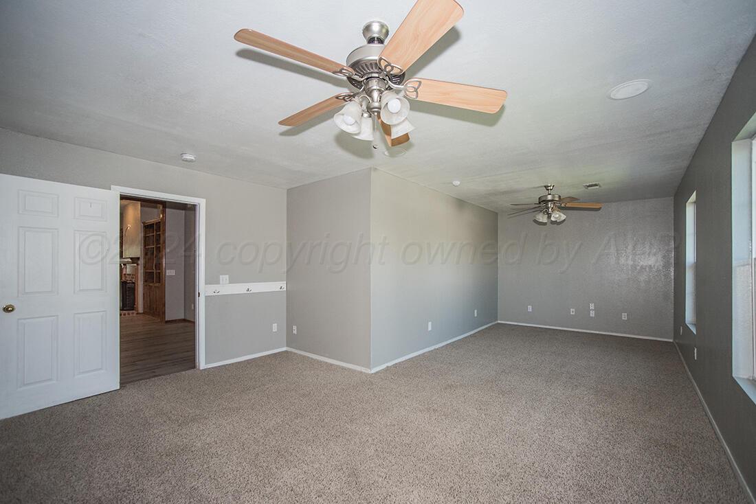 7909 Triumph Place Amarillo, TX 79119 - Photo 21 of 21 a view of an empty room with a ceiling fan