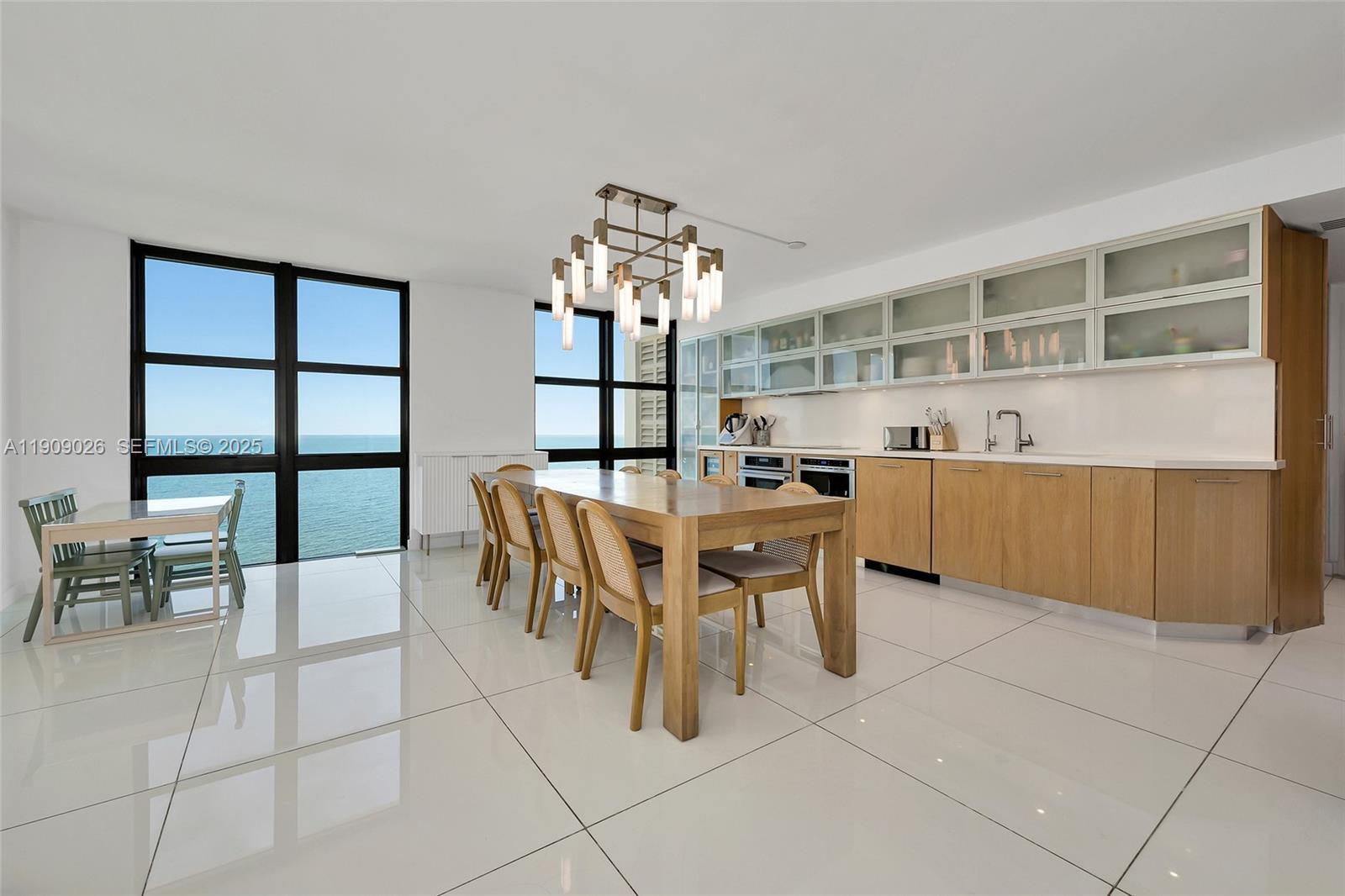 1111 Crandon Boulevard, Unit A801 Key Biscayne, FL 33149 - Photo 11 of 29 a dining room with furniture and window