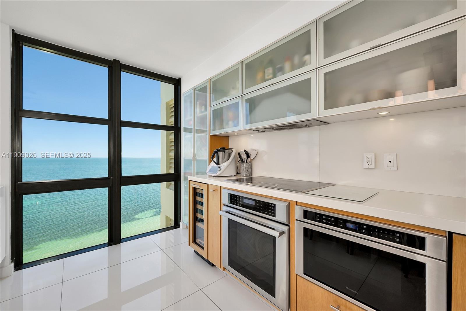 1111 Crandon Boulevard, Unit A801 Key Biscayne, FL 33149 - Photo 14 of 29 a kitchen with a stove and a microwave
