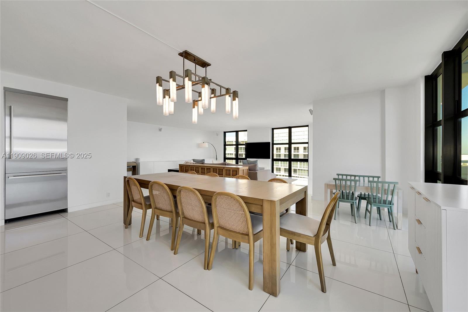 1111 Crandon Boulevard, Unit A801 Key Biscayne, FL 33149 - Photo 15 of 29 a view of a dining room with furniture and wooden floor