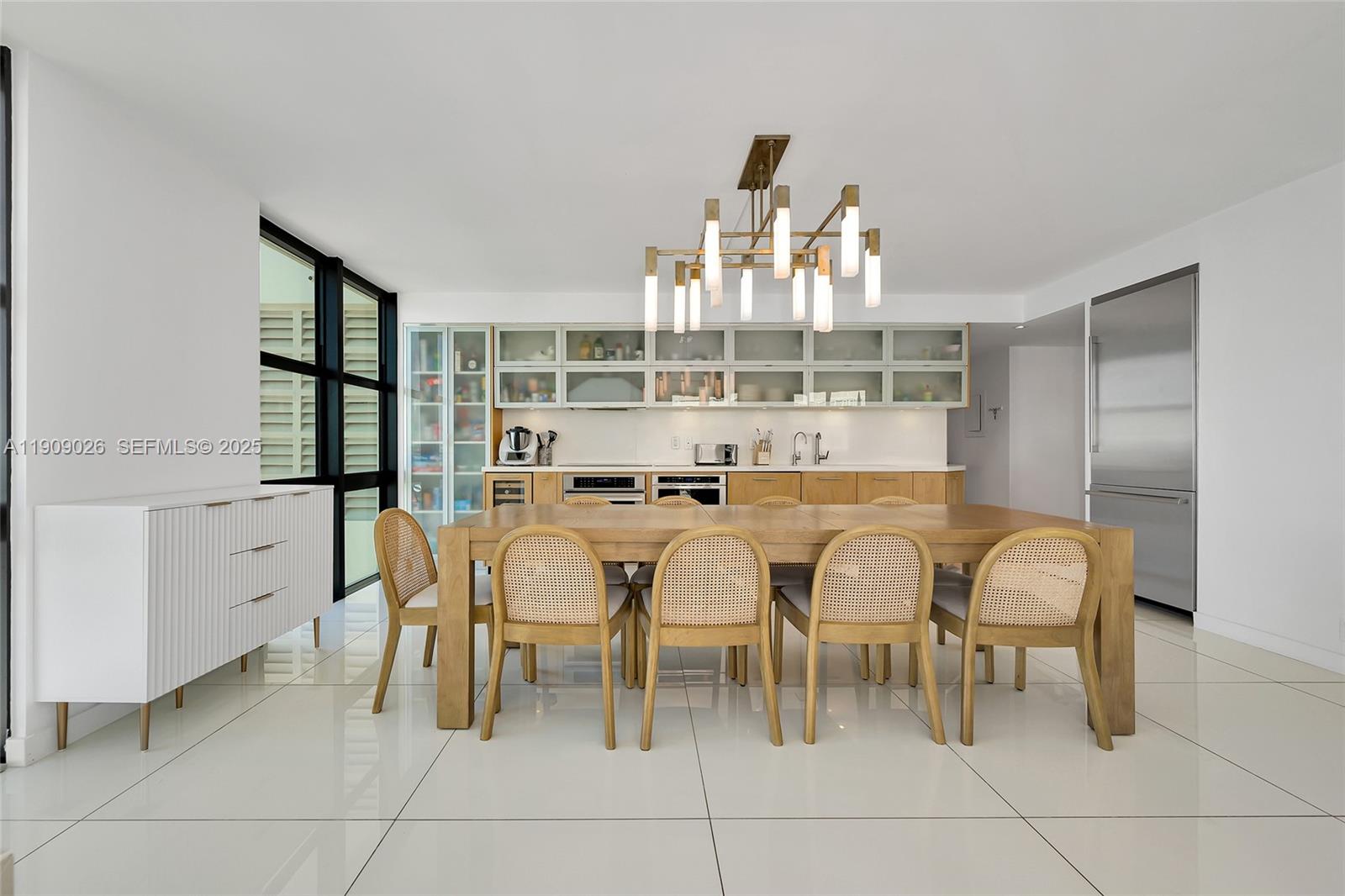 1111 Crandon Boulevard, Unit A801 Key Biscayne, FL 33149 - Photo 16 of 29 a dining area with furniture and view of kitchen