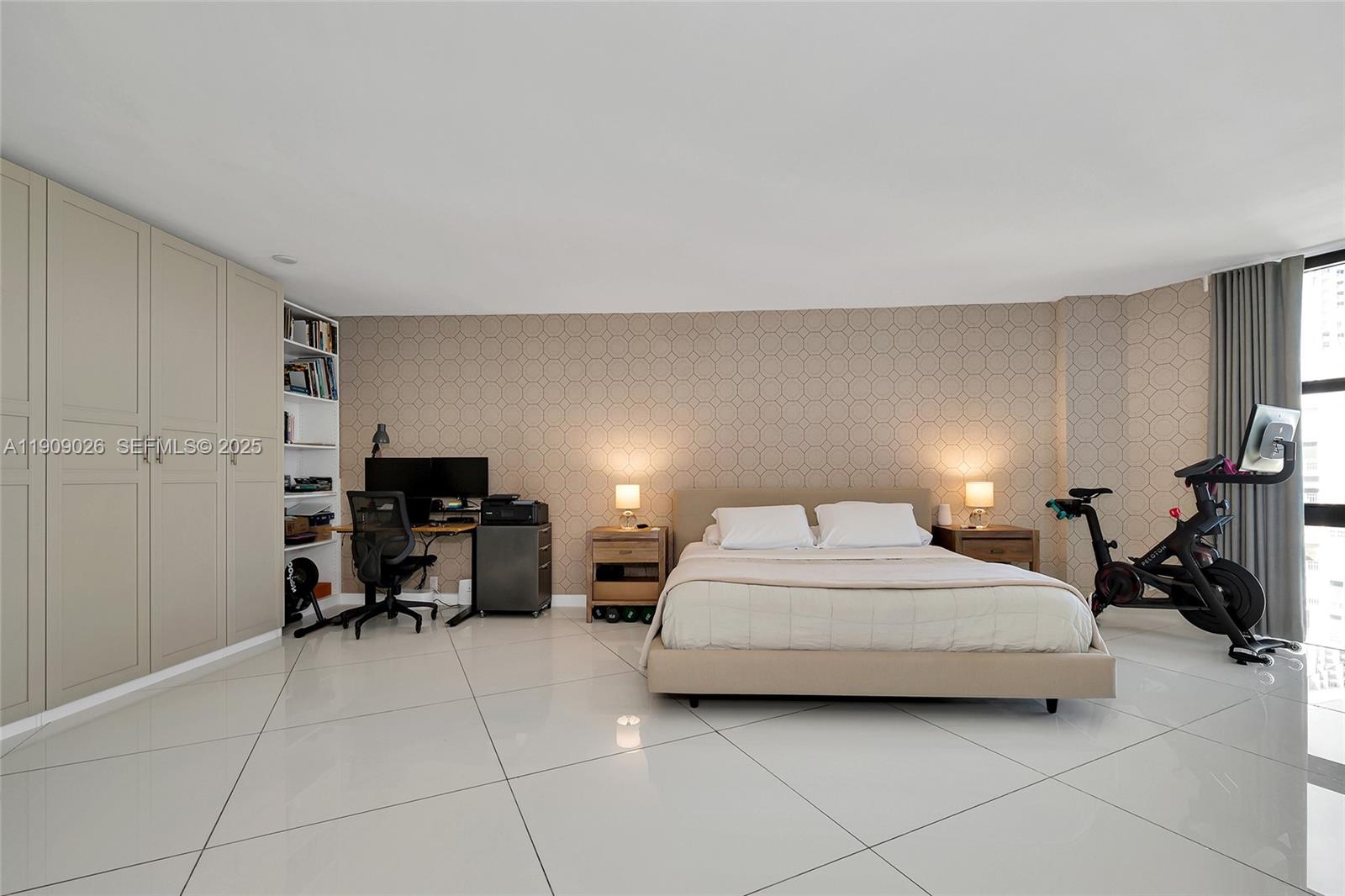 1111 Crandon Boulevard, Unit A801 Key Biscayne, FL 33149 - Photo 17 of 29 a bedroom with a bed and a chair