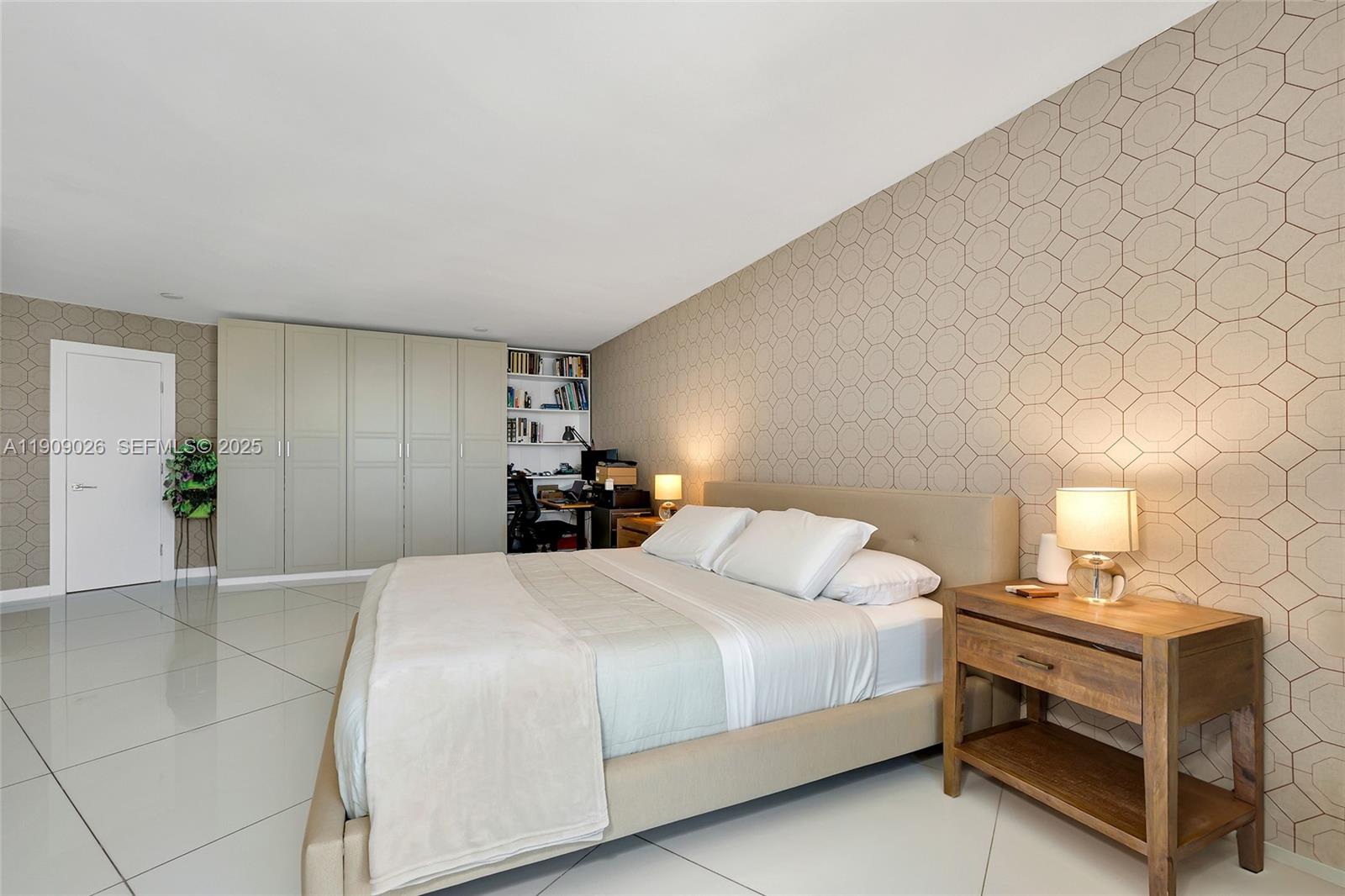 1111 Crandon Boulevard, Unit A801 Key Biscayne, FL 33149 - Photo 19 of 29 a bedroom with a bed and a potted plant