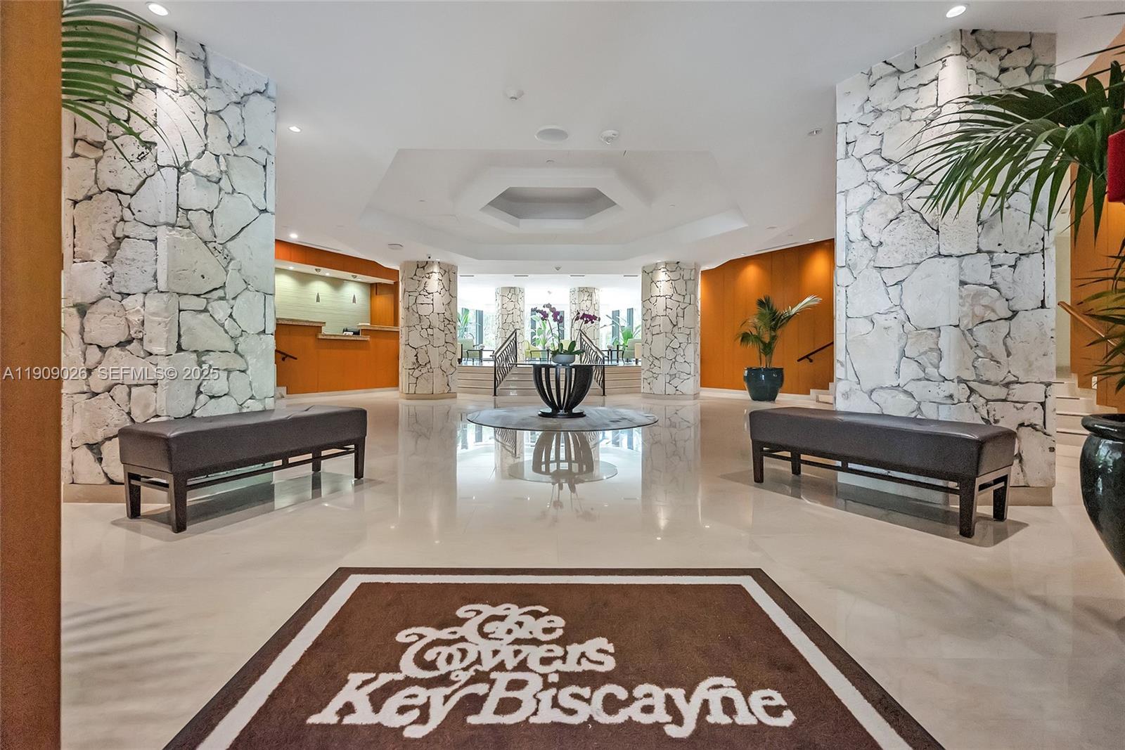 1111 Crandon Boulevard, Unit A801 Key Biscayne, FL 33149 - Photo 4 of 29 a living room with furniture and a flat screen tv