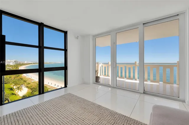 a living room with furniture and a lamp