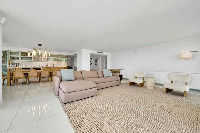 a dining room with furniture and chandelier