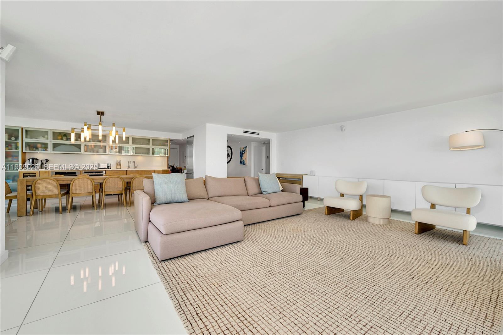 1111 Crandon Boulevard, Unit A801 Key Biscayne, FL 33149 - Photo 9 of 29 a living room with furniture and a lamp