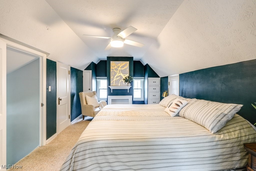 2340 Canterbury Road University Heights, OH 44118 - Photo 21 of 29 Bedroom with carpet floors, baseboards, a textured ceiling, a ceiling fan, and vaulted ceiling