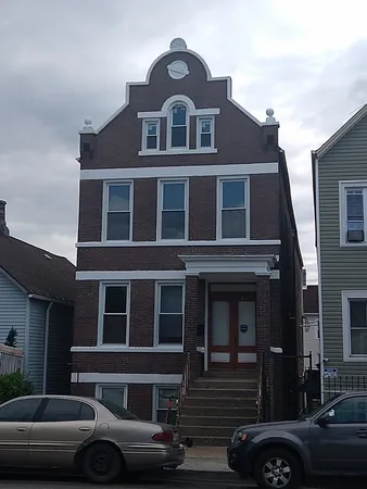 a front view of a house with parking space
