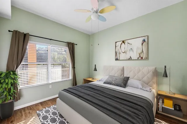 a bedroom with a bed and a window