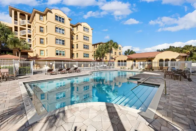 a view of a swimming pool with a lounge chairs