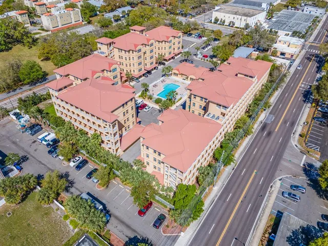 an aerial view of a house with outdoor space pool patio and outdoor seating