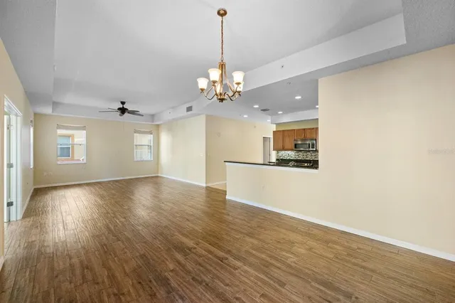 a view of a kitchen with a dishwasher cabinets and wooden floor