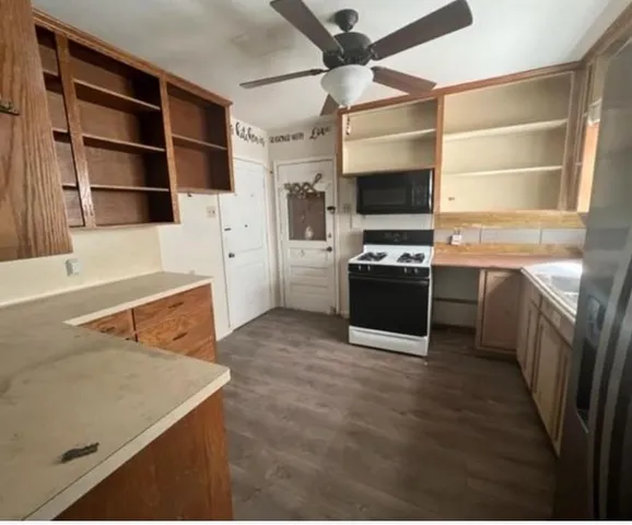 a kitchen with stainless steel appliances a stove and a refrigerator