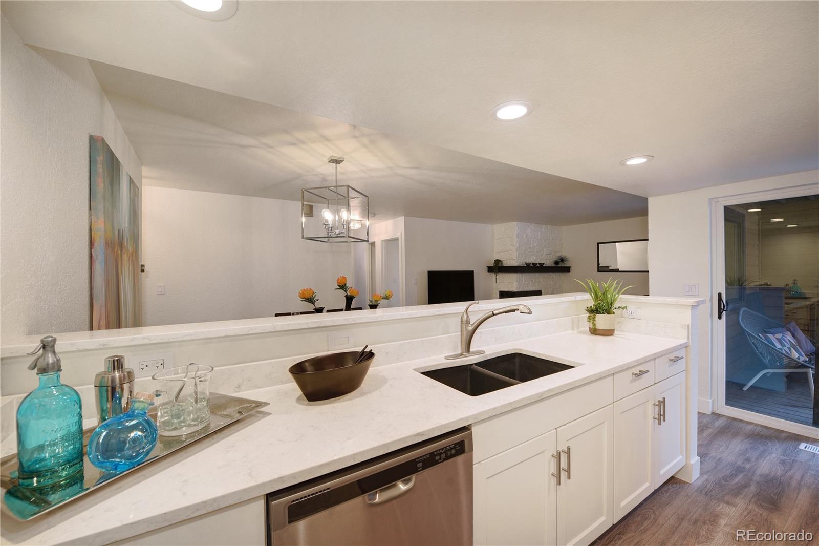 6240 Willow Lane Boulder, CO 80301 - Photo 11 of 25 a kitchen with a sink a counter space and appliances