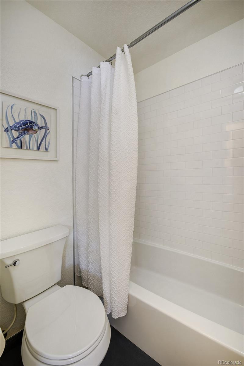 6240 Willow Lane Boulder, CO 80301 - Photo 17 of 25 a white toilet sitting next to a bath tub