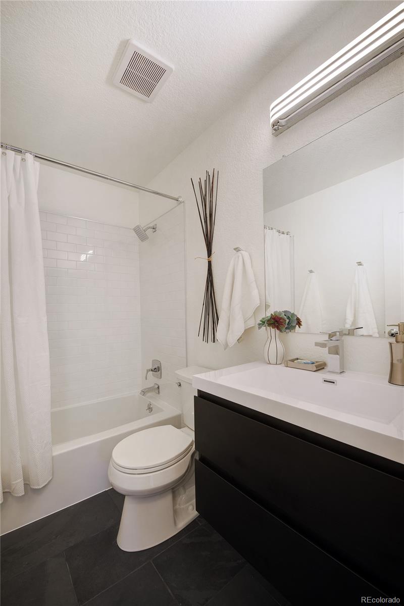 6240 Willow Lane Boulder, CO 80301 - Photo 21 of 25 a bathroom with a sink a toilet and shower