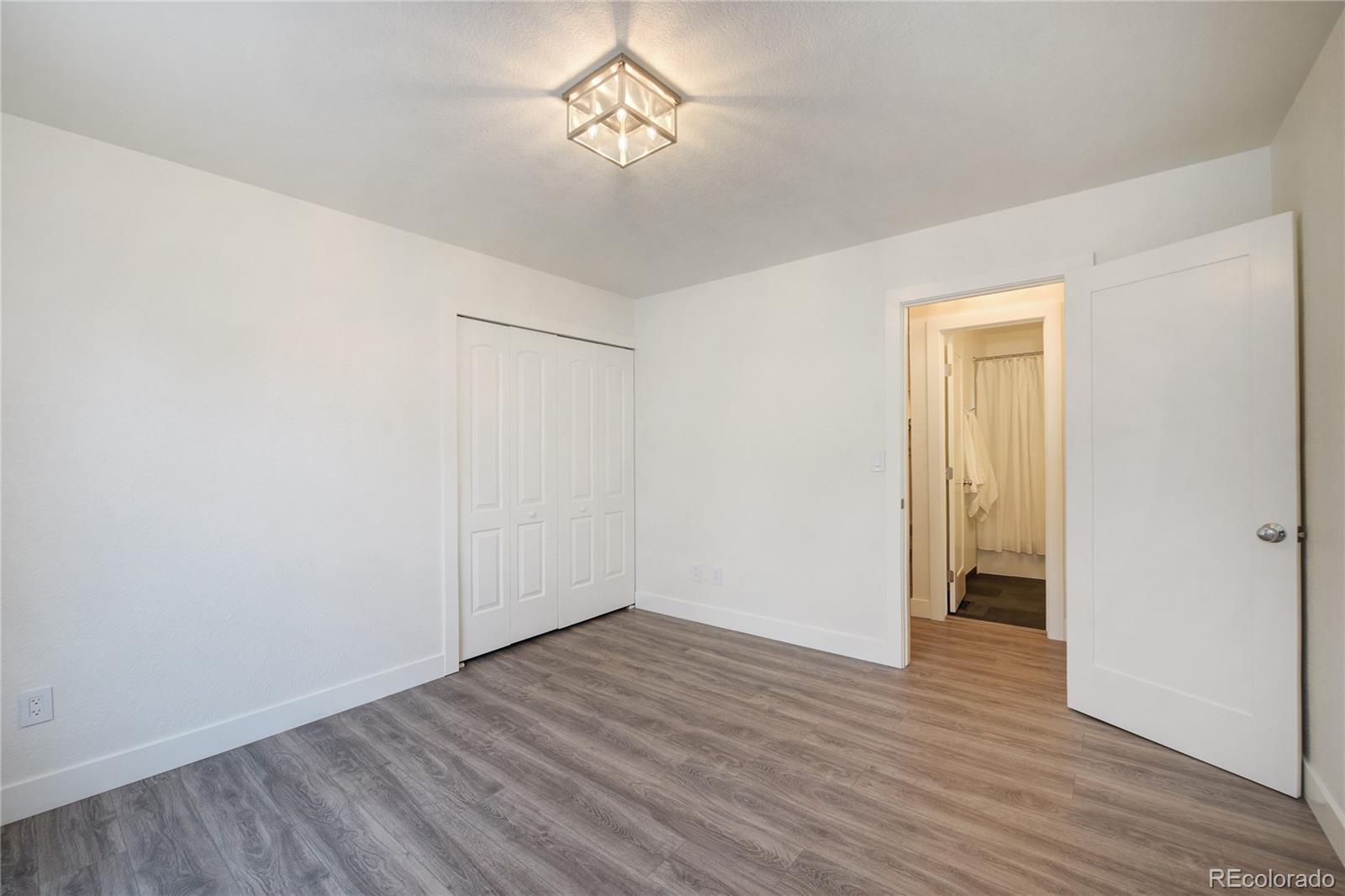 6240 Willow Lane Boulder, CO 80301 - Photo 22 of 25 a view of empty room with wooden floor