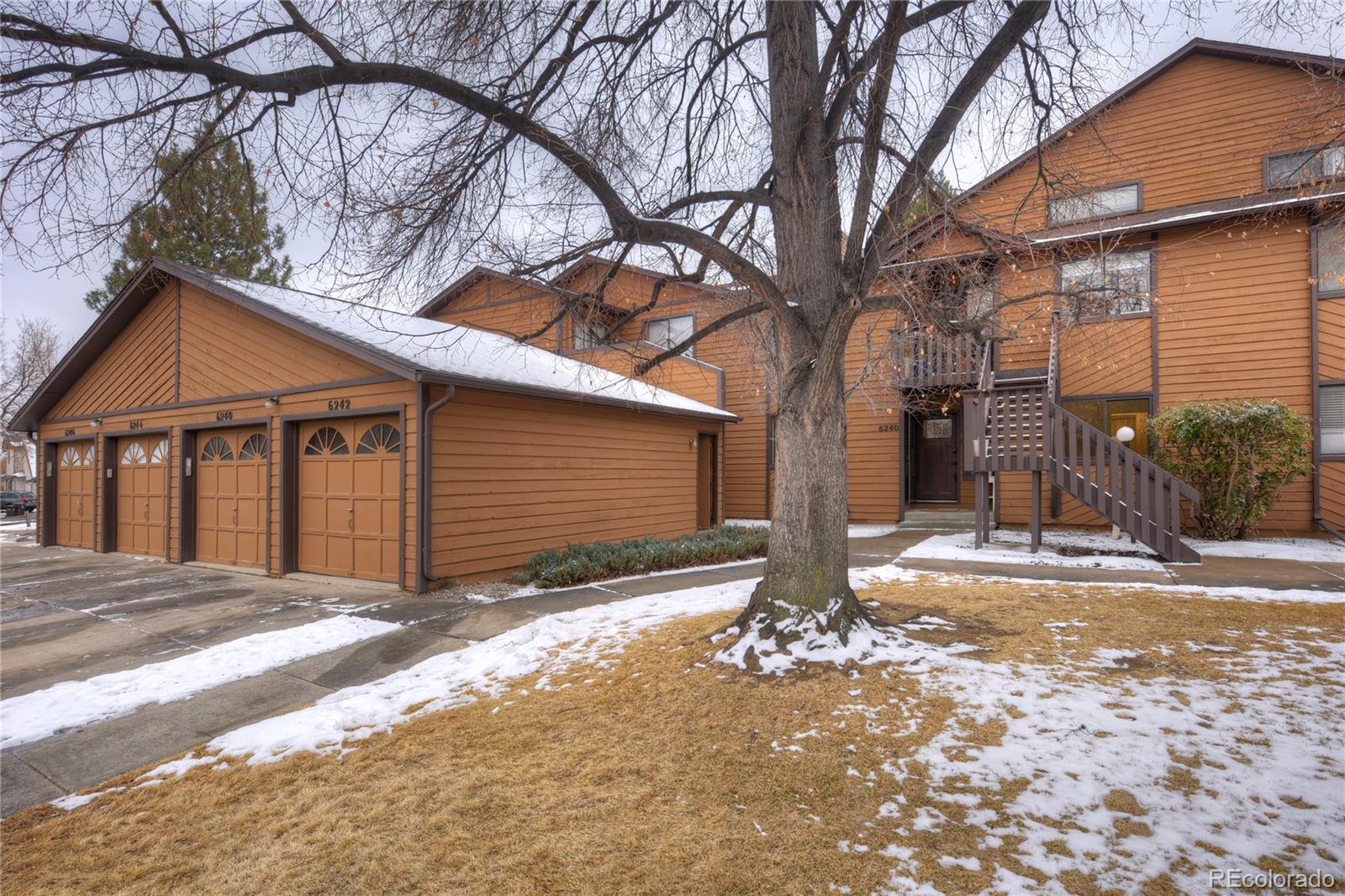 6240 Willow Lane Boulder, CO 80301 - Photo 24 of 25 a view of a house with a yard covered in snow