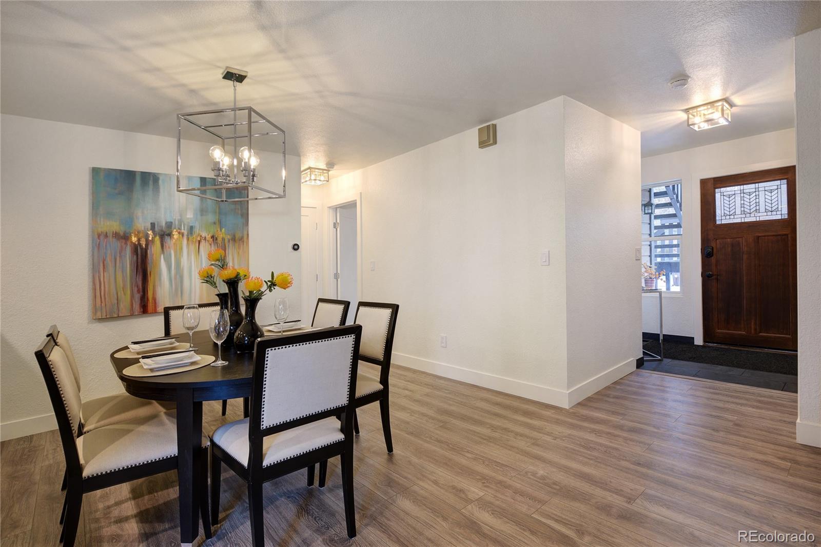 6240 Willow Lane Boulder, CO 80301 - Photo 3 of 25 a view of a dining room with furniture and wooden floor