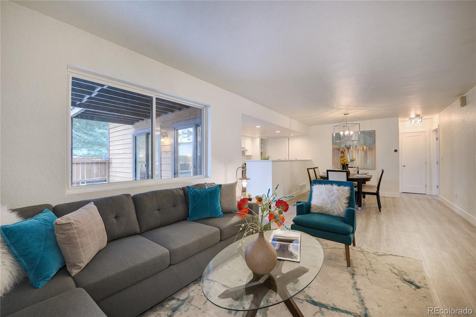 6240 Willow Lane Boulder, CO 80301 - Photo 4 of 25 a living room with furniture and a large window