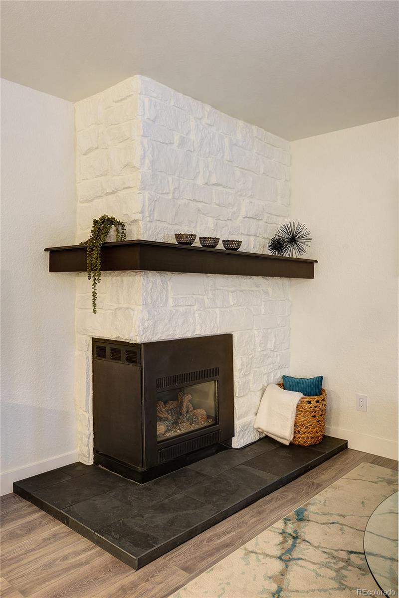 6240 Willow Lane Boulder, CO 80301 - Photo 8 of 25 a living room with furniture and a fireplace