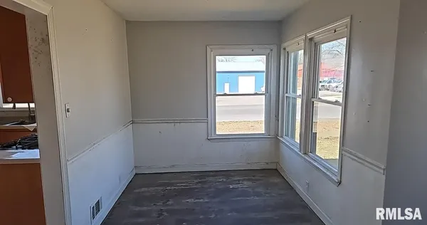 a view of an empty room and window