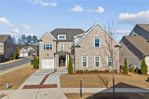 a front view of a house with a yard