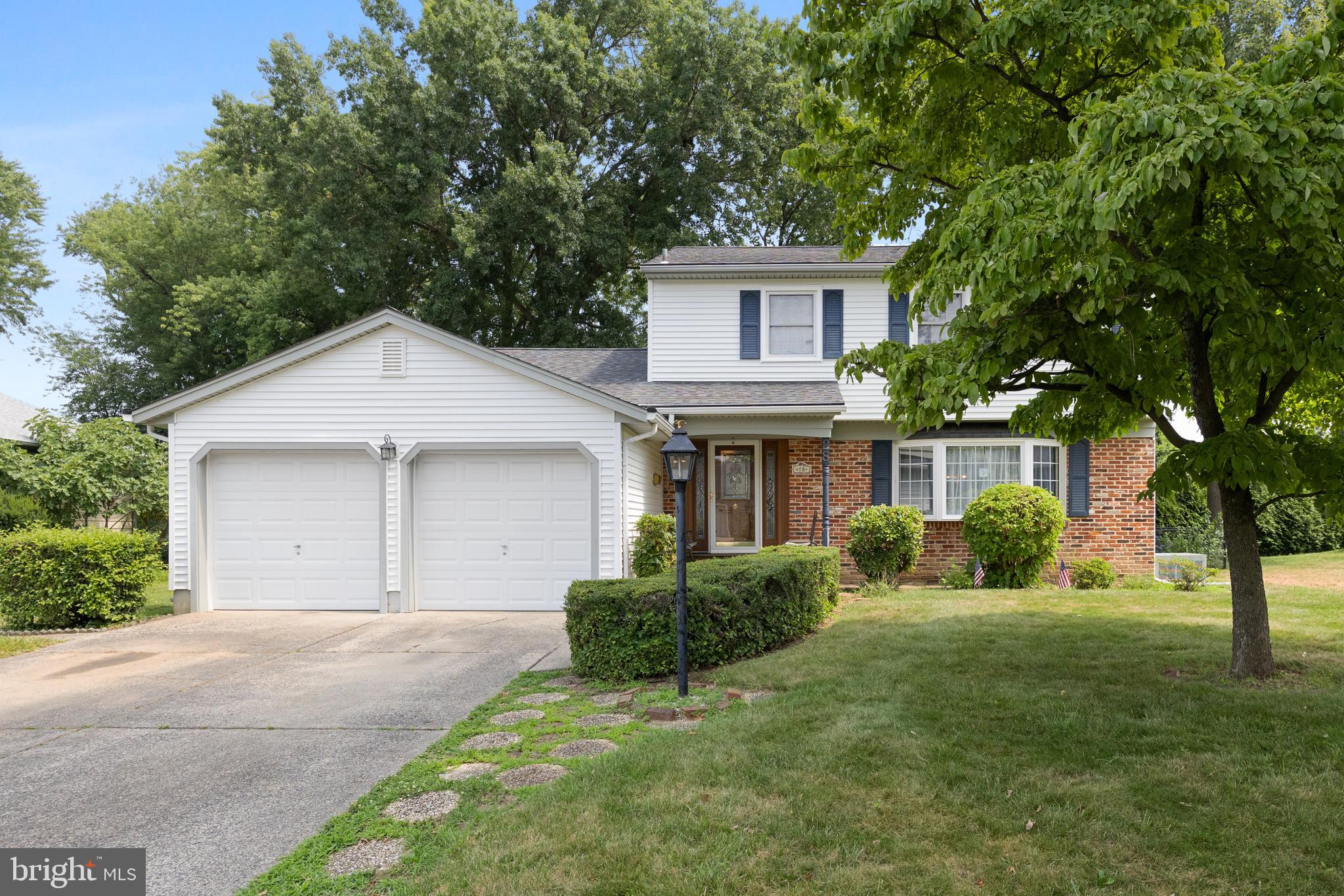 28 Elmgate Road Marlton, NJ 08053 - Photo 1 of 25 a front view of a house with a yard and garage