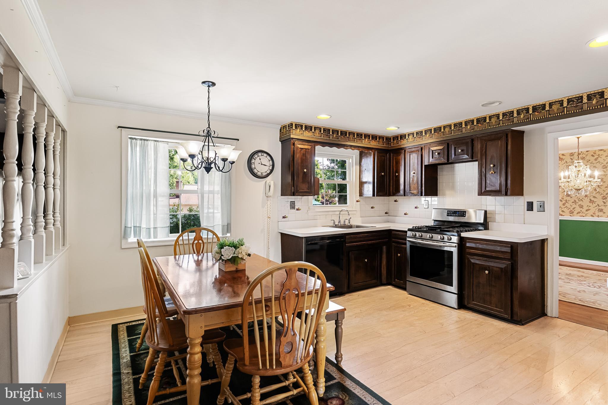 28 Elmgate Road Marlton, NJ 08053 - Photo 11 of 25 a kitchen with a dining table chairs and stove
