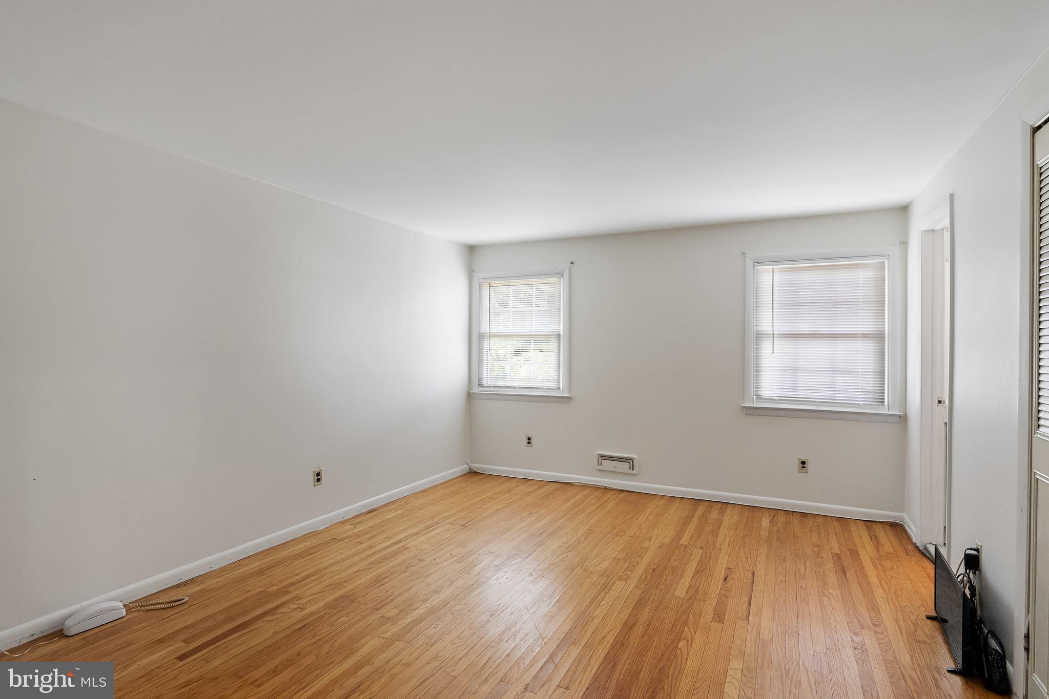 28 Elmgate Road Marlton, NJ 08053 - Photo 17 of 25 an empty room with wooden floor and windows