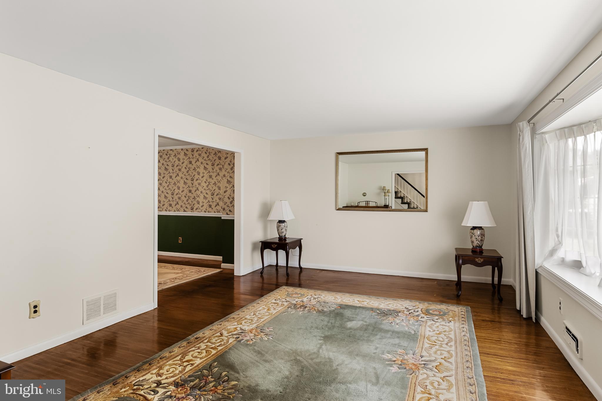 28 Elmgate Road Marlton, NJ 08053 - Photo 3 of 25 a view of a hallway with wooden floor and a bathroom