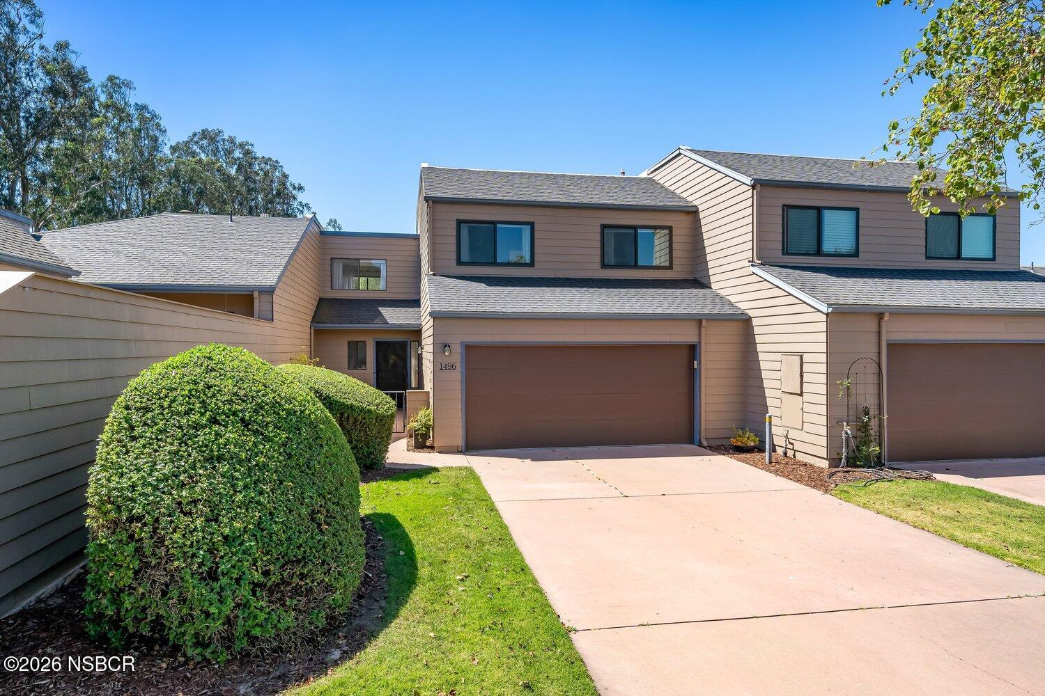 1496 Oakridge Park Road Santa Maria, CA 93455 - Photo 1 of 62 a front view of a house with a garden