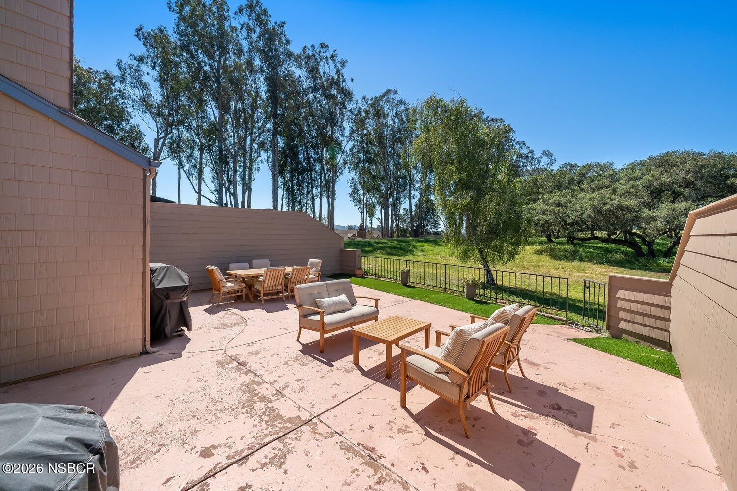 1496 Oakridge Park Road Santa Maria, CA 93455 - Photo 11 of 62 a view of a patio with a table chairs and a table
