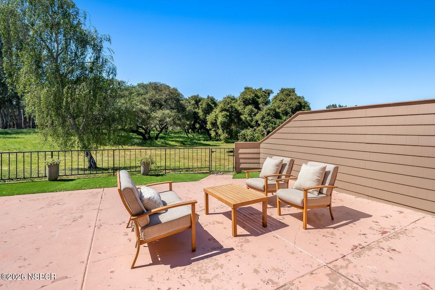 1496 Oakridge Park Road Santa Maria, CA 93455 - Photo 14 of 62 a view of a patio with a yard
