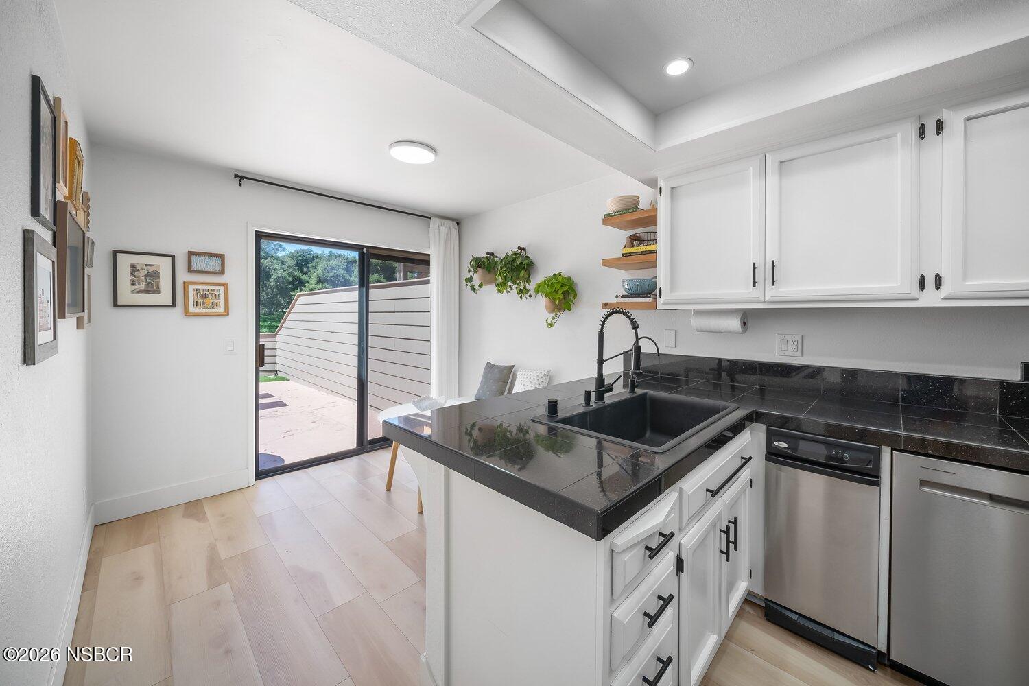 1496 Oakridge Park Road Santa Maria, CA 93455 - Photo 23 of 62 a kitchen with granite countertop a sink stove and cabinets