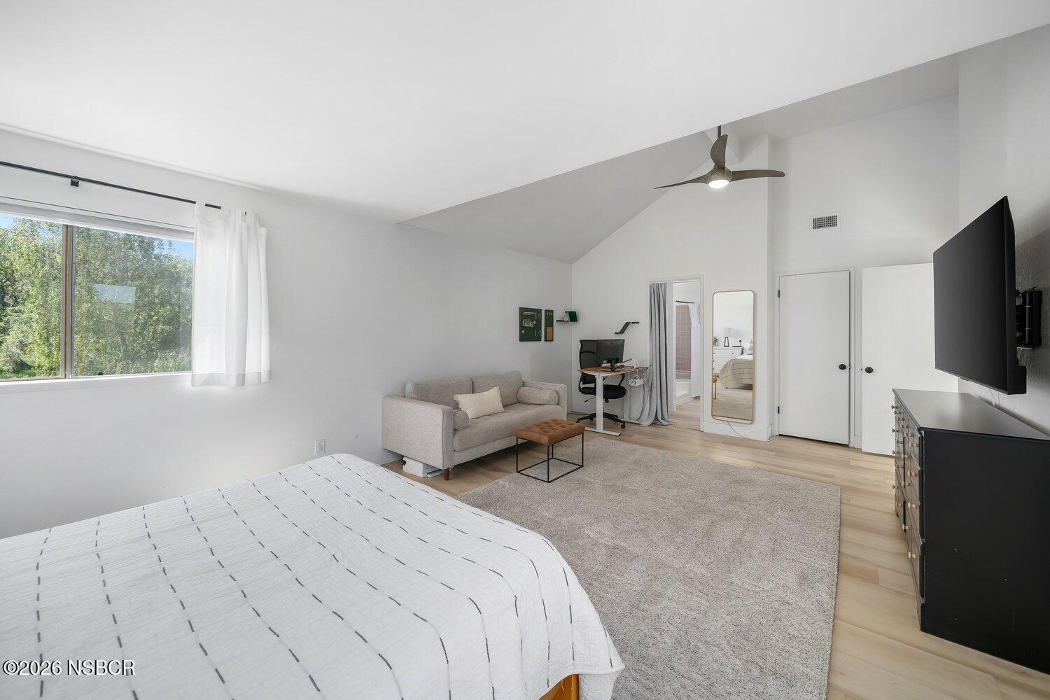 1496 Oakridge Park Road Santa Maria, CA 93455 - Photo 25 of 62 a spacious bedroom with a bed and a flat screen tv