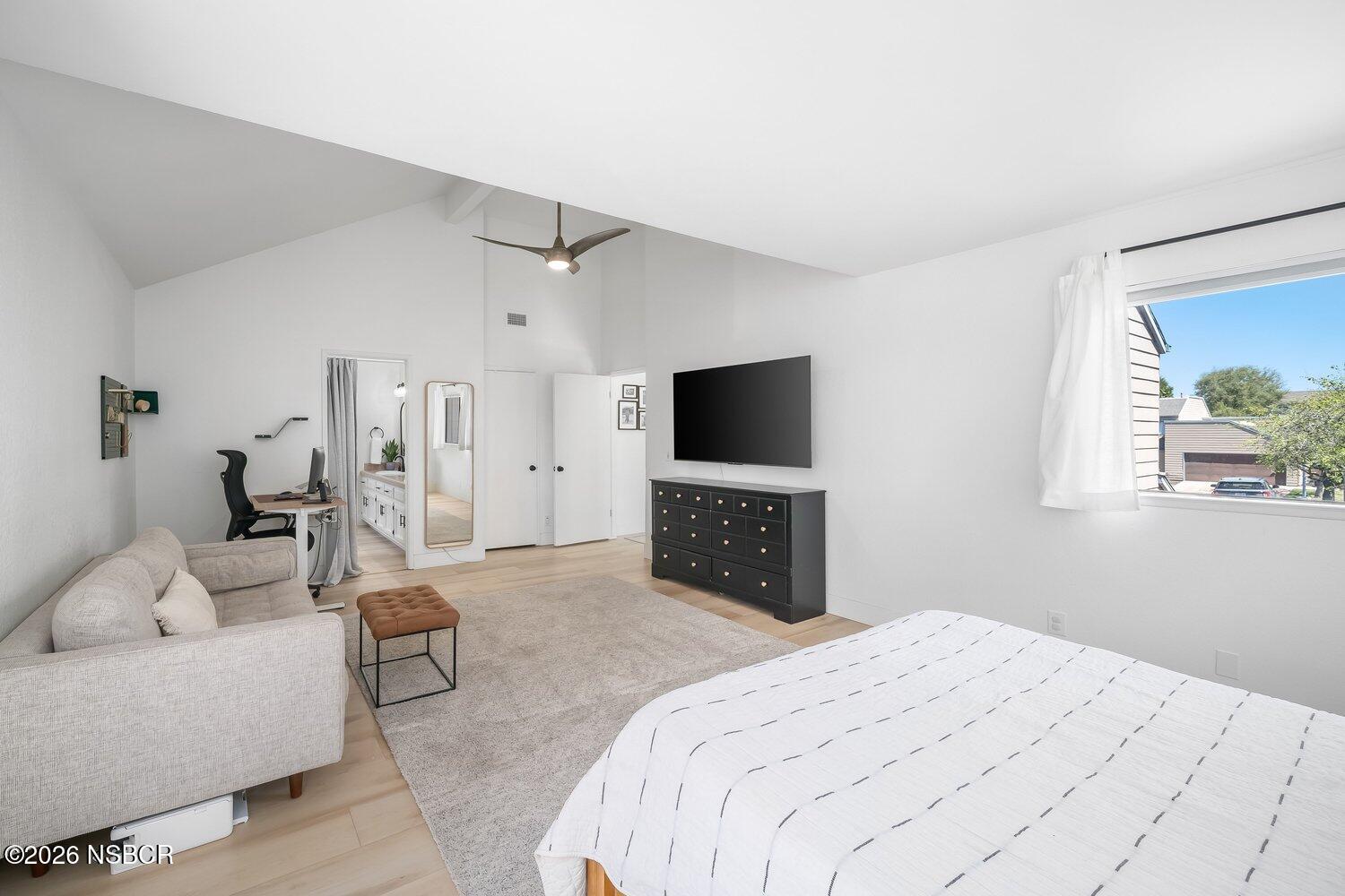 1496 Oakridge Park Road Santa Maria, CA 93455 - Photo 26 of 62 a bedroom with a bed and a flat screen tv