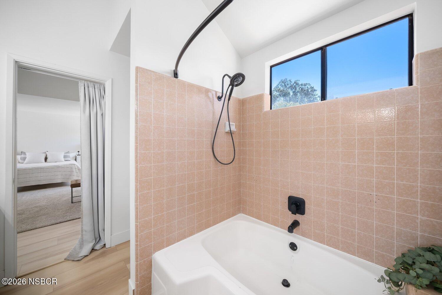 1496 Oakridge Park Road Santa Maria, CA 93455 - Photo 29 of 62 a bathroom with a white bath tub