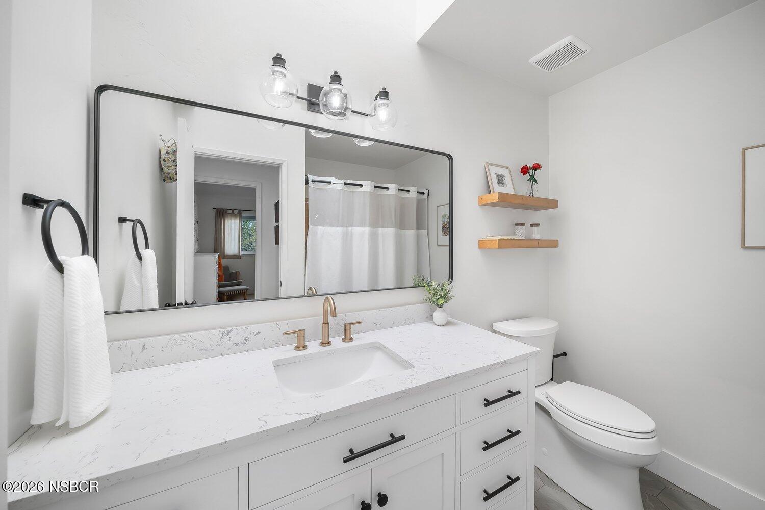 1496 Oakridge Park Road Santa Maria, CA 93455 - Photo 33 of 62 a bathroom with a sink vanity granite and toilet