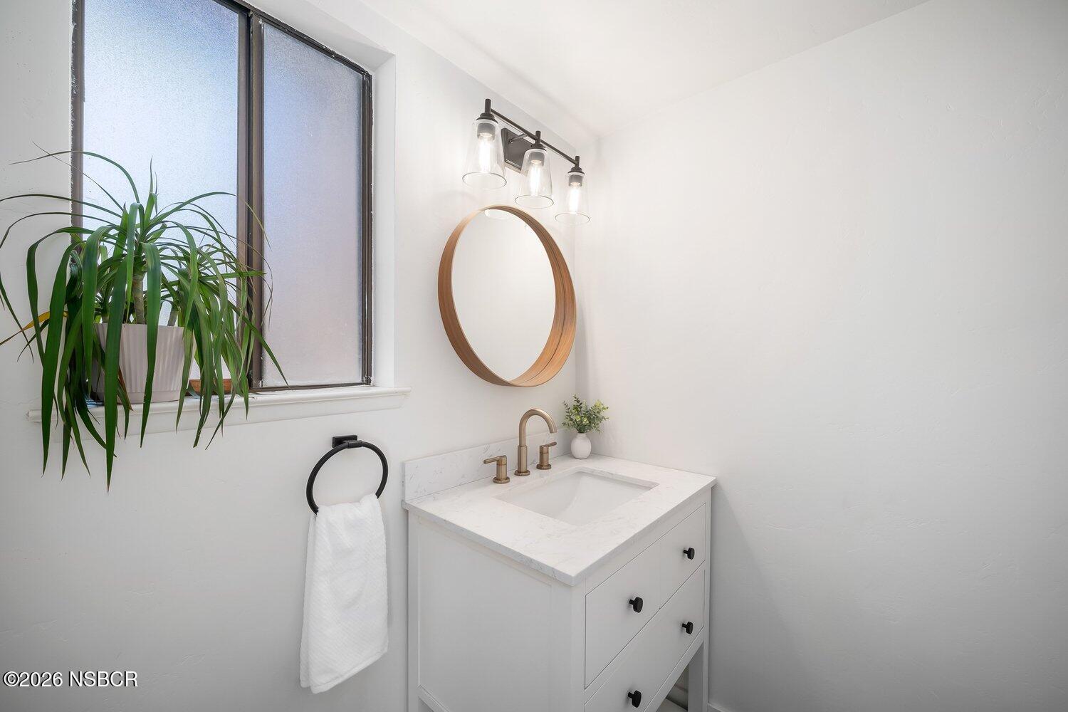 1496 Oakridge Park Road Santa Maria, CA 93455 - Photo 37 of 62 a bathroom with a sink and a mirror