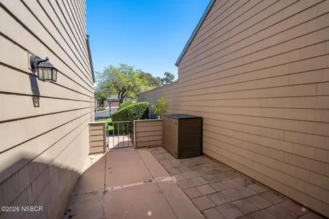 a view of a swimming pool and a yard