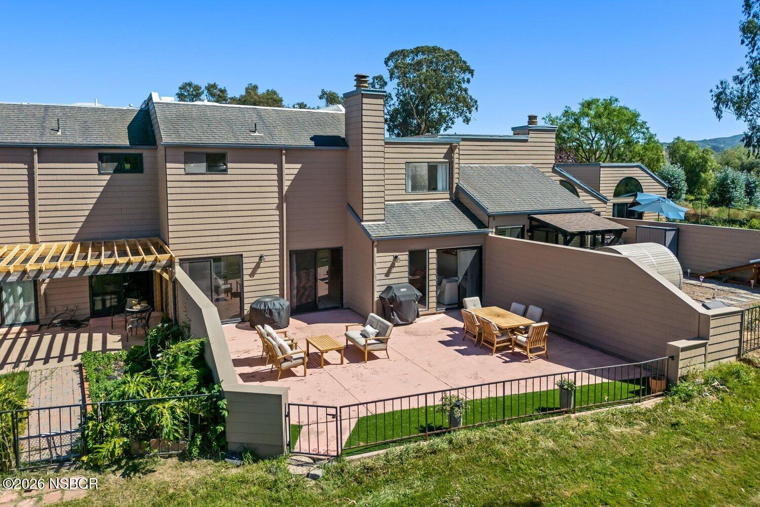 1496 Oakridge Park Road Santa Maria, CA 93455 - Photo 45 of 62 an aerial view of a house with table and chairs