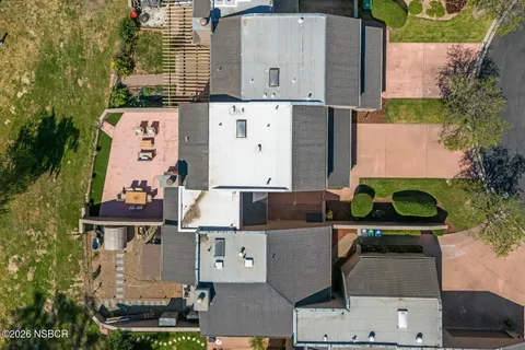 an aerial view of a house with a garden